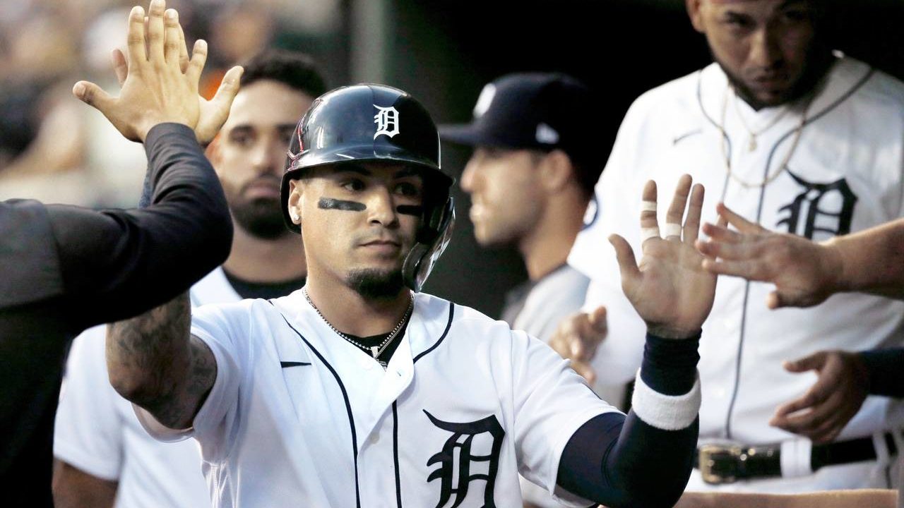 Detroit Tigers' Javier Baez celebrates after scoring against the Chicago White Sox during the first...