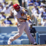 
              St. Louis Cardinals' Yadier Molina connects for an RBI single during the second inning of a baseball game against the Los Angeles Dodgers Sunday, Sept. 25, 2022, in Los Angeles. (AP Photo/Jae C. Hong)
            
