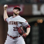 Arizona Diamondbacks' Merrill Kelly pitches against the San Francisco Giants during the first inning of a baseball game in San Francisco, Friday, Sept. 30, 2022. (AP Photo/Godofredo A. Vásquez)