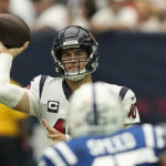 Houston Texans quarterback Davis Mills (10) takes a toss during the second half of an NFL football game Sunday, Sept. 11, 2022, in Houston. (AP Photo/David J. Phillip)