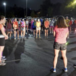 
              Runners pray before heading out for "Finish Eliza's Run" on Friday, Sept. 9, 2022 in Chattanooga, Tenn.  The approximately four mile run was to memorialize, Eliza Fletcher, the Memphis runner, and mother of two, who was murdered during her early morning run.   (Robin Rudd /Chattanooga Times Free Press via AP)
            