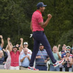 
              Tony Finau celebrates his victory over Sebastian Munoz, of Colombia, on the 17th green during their singles match at the Presidents Cup golf tournament at the Quail Hollow Club, Sunday, Sept. 25, 2022, in Charlotte, N.C. (AP Photo/Chris Carlson)
            