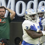 
              Middle Tennessee defensive tackle Zaylin Wood (7) celebrates with cornerback Decorian Patterson (33) after Wood intercepted the ball and scored during the first half of an NCAA college football game against Miami, Saturday, Sept. 24, 2022, in Miami Gardens, Fla. (AP Photo/Wilfredo Lee)
            