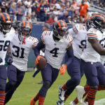
              Chicago Bears safety Eddie Jackson (4) celebrates with teammates after intercepting a pass in the end zone against the Houston Texans during the first half of an NFL football game Sunday, Sept. 25, 2022, in Chicago. (AP Photo/Nam Y. Huh)
            