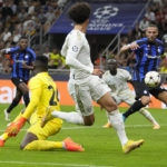 Bayern's Leroy Sane watches Inter Milan's Danilo D'Ambrosio, right, scoring an own goal to give Bayern a 2-0 lead, during the Champions League, group C soccer match between Inter Milan and Bayern Munich, at the Milan San Siro stadium, Italy, Wednesday, Sept. 7, 2022. (AP Photo/Luca Bruno)