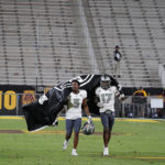 Eastern Michigan's Korey Hernandez (5) and Mark Lee Jr. (17) take a victory lap after their 30-21 win over Arizona State's at the end of an NCAA college football game Saturday, Sept. 17, 2022, in Tempe, Ariz. (AP Photo/Darryl Webb)