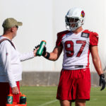 Arizona Cardinals OLB Cameron Thomas takes a drink in between drills during practice on Friday, Oct. 14, 2022, in Tempe. (Tyler Drake/Arizona Sports)