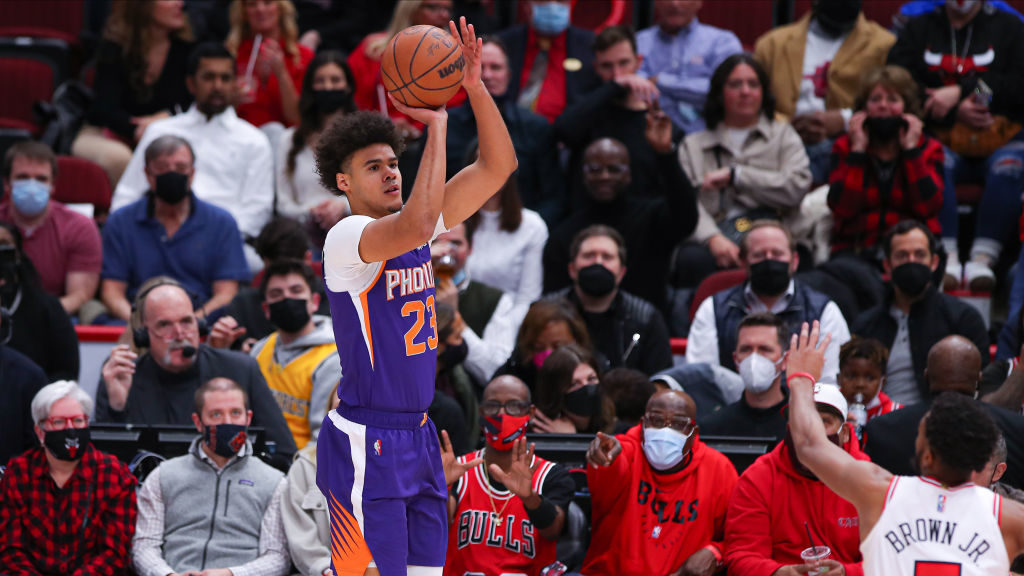 Phoenix Suns Forward Cameron Johnson (23) shoots a three point basket during a NBA game between the...