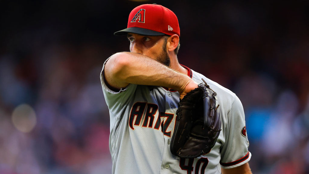 Madison Bumgarner #40 of the Arizona Diamondbacks reacts at the end of the third inning against the...