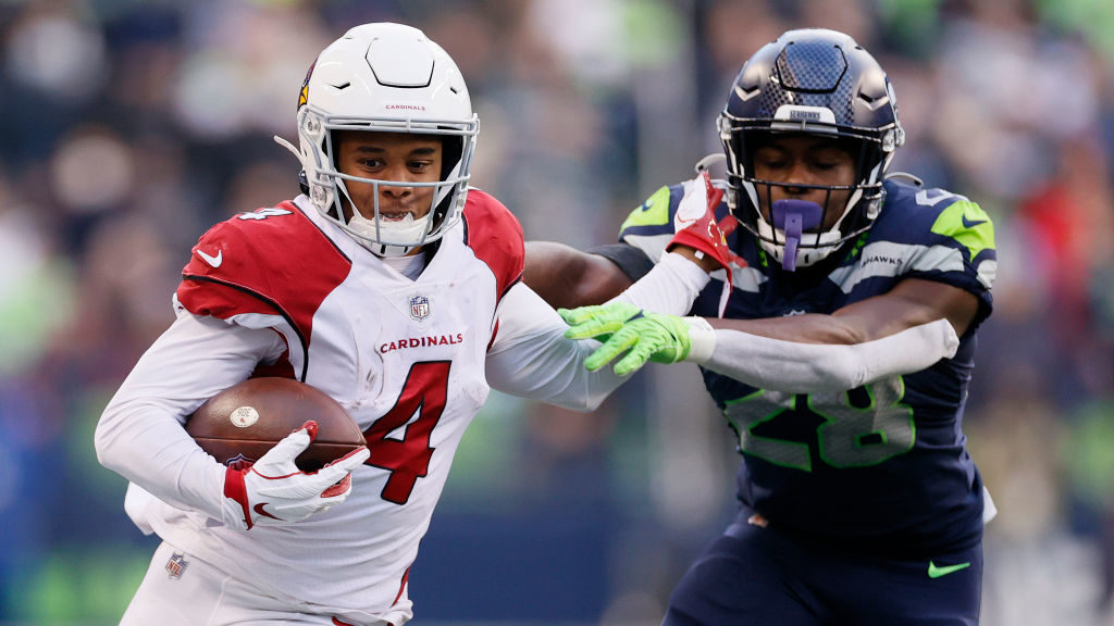 Rondale Moore #4 of the Arizona Cardinals catches the ball and runs passed Ugo Amadi #28 of the Sea...