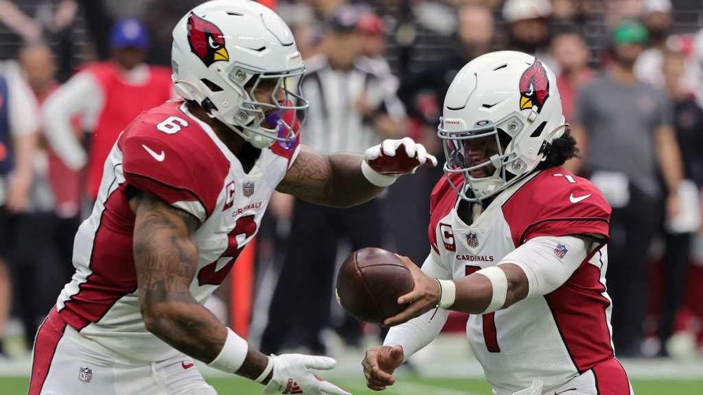 Kyler Murray #1 hands the ball off to James Conner #6 of the Arizona Cardinals in the second quarte...