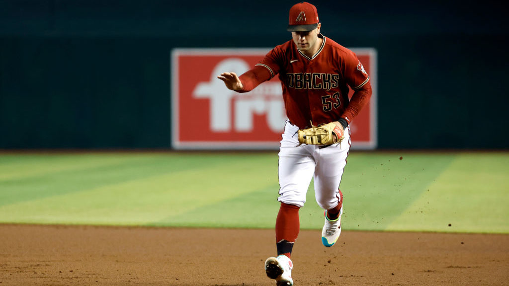 Christian Walker #53 of the Arizona Diamondbacks tags first base during the second inning against t...