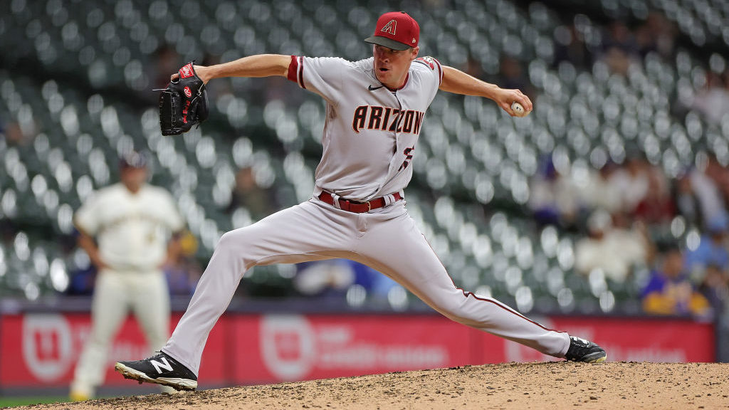 Joe Mantiply #35 of the Arizona Diamondbacks throws a pitch during the ninth inning against the Mil...