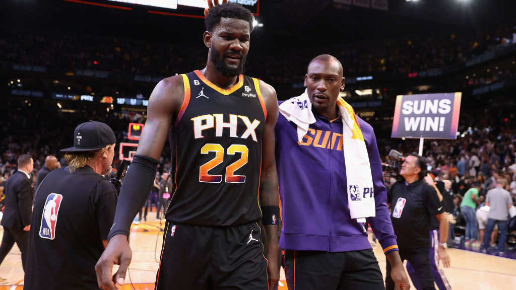 Deandre Ayton #22 and Bismack Biyombo #18 of the Phoenix Suns celebrate after defeating the Dallas ...