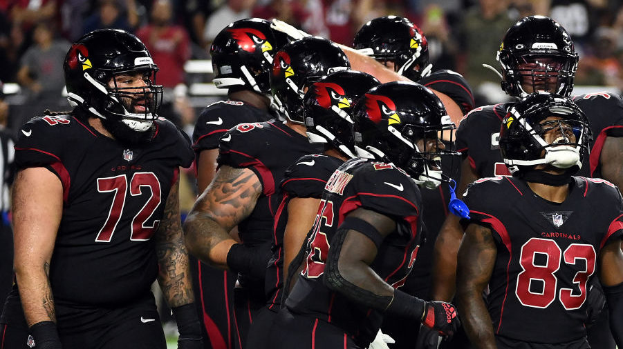 Greg Dortch #83 of the Arizona Cardinals celebrates with teammates after scoring a touchdown during...