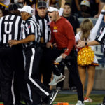 Head coach Lincoln Riley of the USC Trojans talks to referee Michael Mothershed during the first half of the game against the Arizona Wildcats at Arizona Stadium on October 29, 2022 in Tucson, Arizona. (Photo by Chris Coduto/Getty Images)