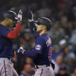 
              Minnesota Twins' Mark Contreras, right, is greeted by teammate fLuis Arraez after hitting a solo home run during the fifth inning of a baseball game against the Detroit Tigers, Saturday, Oct. 1, 2022, in Detroit. (AP Photo/Carlos Osorio)
            