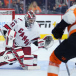 
              Carolina Hurricanes' Antti Raanta, left, cannot stop a goal by Philadelphia Flyers' Owen Tippett, right, during the second period of an NHL hockey game, Saturday, Oct. 29, 2022, in Philadelphia. (AP Photo/Matt Slocum)
            