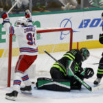 New York Rangers center Mika Zibanejad (93) scores past Dallas Stars goalie Scott Wedgewood (41) during the second period of an NHL hockey game in Dallas, Saturday, Oct. 29, 2022. (AP Photo/Michael Ainsworth)