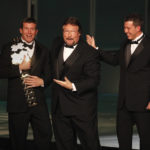 
              FILE - In this March 27, 2010, file photo, WWE Superstar Ted DiBiase Jr., left, with brother Brett DiBiase, right, induct their father "Million Dollar Man" Ted DiBiase into the 2010 WWE Hall of Fame at the Ceremony in Phoenix, Ariz. Mississippi’s largest public corruption case in state history involves tens of millions of misspent dollars earmarked for needy families. The civil lawsuit involves a number of sports figures with ties to the state, including Ted DiBiase and sons Teddy and Brett. (Rick Scuteri/AP Images for WWE, File)
            