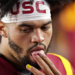 Southern California quarterback Caleb Williams slicks his fingers while standing on the sideline during the second half of an NCAA college football game against Arizona State Saturday, Oct. 1, 2022, in Los Angeles. (AP Photo/Mark J. Terrill)