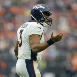 Denver Broncos quarterback Russell Wilson (3) looks to his bench after an incomplete pass against the Las Vegas Raiders during the second half of an NFL football game, Sunday, Oct. 2, 2022, in Las Vegas. (AP Photo/Abbie Parr)