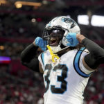 Carolina Panthers running back D'Onta Foreman celebrates after scoring on a 1-yard run during the second half of an NFL football game against the Atlanta Falcons Sunday, Oct. 30, 2022, in Atlanta. (AP Photo/John Bazemore)