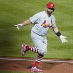 
              St. Louis Cardinals' Albert Pujols celebrates as he heads to first base after he hit career home run No. 703 during the fifth inning of a baseball game against the Pittsburgh Pirates, Monday, Oct. 3, 2022, in Pittsburgh. (AP Photo/Keith Srakocic)
            