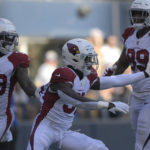 Arizona Cardinals' Chris Banjo, middle, celebrates after recovering a fumble for a touchdown during the second half of an NFL football game against the Seattle Seahawks in Seattle, Sunday, Oct. 16, 2022. (AP Photo/Caean Couto)