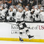 Los Angeles Kings' Gabriel Vilardi is congratulated for his goal during the first period of the team's NHL hockey game against the Vegas Golden Knights on Tuesday, Oct. 11, 2022, in Los Angeles. (AP Photo/Jae C. Hong)