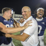 
              Georgia Southern head coach Clay Helton, center, celebrates with Georgia Southern defensive back Jalen Denton, right, and Georgia Southern long snapper Jackson Wheeler, left, after the second half of an NCAA football game against James Madison, Saturday, Oct. 15, 2022, in Statesboro, Ga.. (AP Photo/Stephen B. Morton)
            