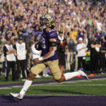 Washington running back Sam Adams II runs into the end zone to score against the Arizona during the first half on an NCAA football game, Saturday, Oct. 15, 2022, in Seattle. (AP Photo/John Froschauer)