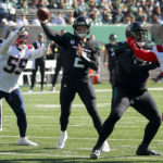 
              New York Jets quarterback Zach Wilson (2) passes against the New England Patriots during the first quarter of an NFL football game, Sunday, Oct. 30, 2022, in New York. (AP Photo/Noah Murray)
            