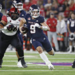 
              Fresno State quarterback Jake Haener heads downfield in his first game back from and ankle injury against San Diego State during the first half of an NCAA college football game in Fresno, Calif., Saturday, Oct. 29, 2022. (AP Photo/Gary Kazanjian)
            