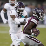 
              Texas A&M wide receiver Evan Stewart looses a pass as Mississippi State cornerback Emmanuel Forbes  reaches in to intercept during the second half of an NCAA college football game against Mississippi State in Starkville, Miss., Saturday, Oct. 1, 2022. Mississippi State won 42-24. (AP Photo/Rogelio V. Solis)
            