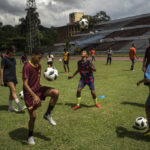 
              Youths train at the Pedro Marrero stadium in Havana, Cuba, Wednesday, Sept. 14, 2022. Soccer coaches across Cuba are training dozens of players as part of a new program to elevate the sport's profile and status in a country that last qualified for the FIFA World Cup in 1938. (AP Photo/Ramon Espinosa)
            