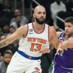 New York Knicks' Evan Fournier gets past Milwaukee Bucks' Grayson Allen during the first half of an NBA basketball game Friday, Oct. 28, 2022, in Milwaukee. (AP Photo/Morry Gash)