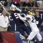 Arizona wide receiver Dorian Singer (5) makes the catch while being defended by Colorado cornerback Nigel Bethel Jr. in the first half during an NCAA college football game, Saturday, Oct. 1, 2022, in Tucson, Ariz. (AP Photo/Rick Scuteri)