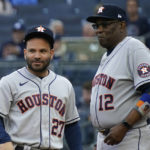 
              Houston Astros manager Dusty Baker Jr. (12) stands on the field with second baseman Jose Altuve (27) during player introductions before Game 3 of an American League Championship baseball series, against the New York Yankees Saturday, Oct. 22, 2022, in New York. (AP Photo/Seth Wenig)
            