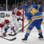 
              St. Louis Blues' Ivan Barbashev (49) is unable to score past Montreal Canadiens goaltender Jake Allen (34) and Jordan Harris (54) during the second period of an NHL hockey game Saturday, Oct. 29, 2022, in St. Louis. (AP Photo/Jeff Roberson)
            