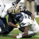 New Orleans Saints defensive end Cameron Jordan sacks Seattle Seahawks quarterback Geno Smith during an NFL football game in New Orleans, Sunday, Oct. 9, 2022. (AP Photo/Gerald Herbert)