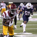 Southern California wide receiver Tahj Washington (16) scores a touchdown against Arizona in the second half during an NCAA college football game, Saturday, Oct. 29, 2022, in Tucson, Ariz. (AP Photo/Rick Scuteri)