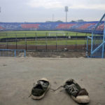 
              A pair of sneakers sit trampled in the stands of Kanjuruhan Stadium following a deadly soccer match stampede, in Malang, East Java, Indonesia, Sunday, Oct. 2, 2022. Panic at an Indonesian soccer match after police fired tear gas to to disperse supporters invading the pitch left over 100 people dead, mostly trampled to death, police said Sunday. (AP Photo/Hendra Permana)
            