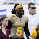 An injured Arizona State's quarterback Emory Jones (5) walks off the field during the first half of an NCAA college football game against Washington in Tempe, Ariz., Saturday, Oct. 8, 2022. (AP Photo/Ross D. Franklin)