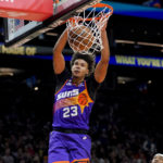 Phoenix Suns forward Cameron Johnson (23) dunks the ball against the New Orleans Pelicans during the second half of an NBA basketball game, Friday, Oct. 28, 2022, in Phoenix. (AP Photo/Matt York)