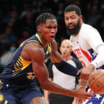 
              Indiana Pacers guard Bennedict Mathurin (00), left, is fouled by Brooklyn Nets forward Markieff Morris, right, during the first half of an NBA basketball game, Saturday, Oct. 29, 2022, in New York. (AP Photo/Noah K. Murray)
            