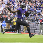 
              Baltimore Ravens running back Gus Edwards (35) runs for a touchdown against the Cleveland Browns in the first half of an NFL football game, Sunday, Oct. 23, 2022, in Baltimore. (AP Photo/Nick Wass)
            