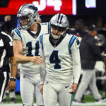 Carolina Panthers place kicker Eddy Pineiro (4) reacts after missing an extra point during the second half of an NFL football game against the Atlanta Falcons Sunday, Oct. 30, 2022, in Atlanta. (AP Photo/John Amis)