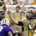 
              Arizona State's quarterback Trenton Bourguet, right, throws a touchdown pass as Washington's linebacker Dominique Hampton (7) applies pressure during the first half of an NCAA college football game in Tempe, Ariz., Saturday, Oct. 8, 2022. (AP Photo/Ross D. Franklin)
            