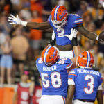 Florida running back Montrell Johnson Jr. (2) celebrates with teammates offensive lineman Austin Barber (58) and wide receiver Xzavier Henderson after his touchdown against LSU during the first half of an NCAA college football game, Saturday, Oct. 15, 2022, in Gainesville, Fla. (AP Photo/John Raoux)
